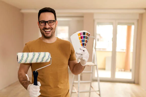 Santa Clarita painter holding roller and color fan